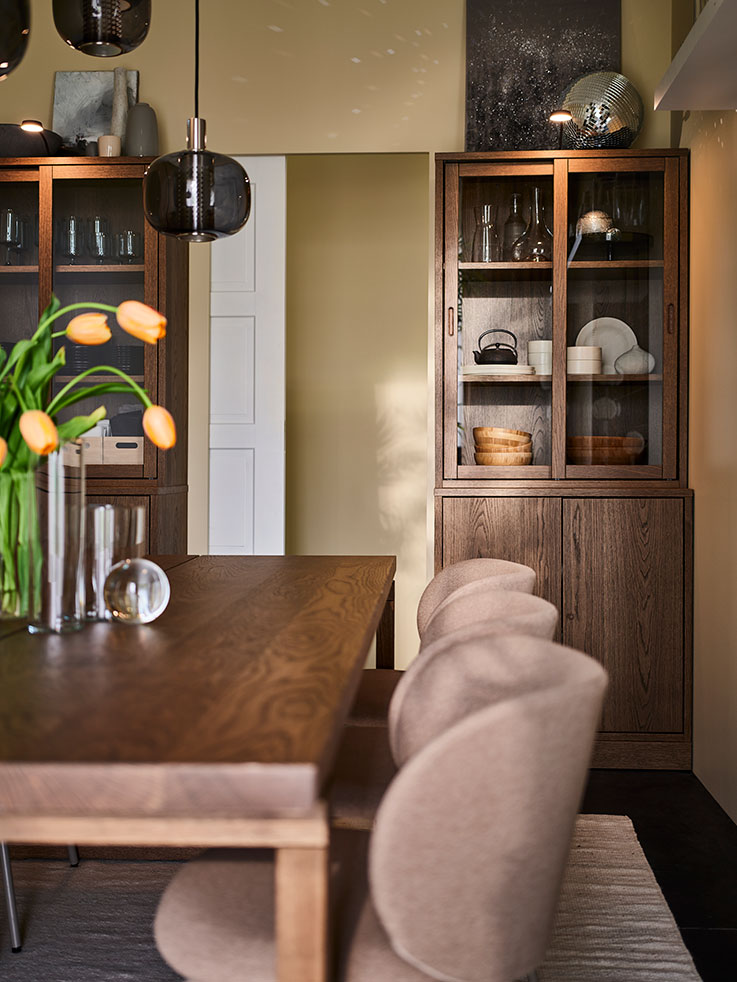 Two cabinets on either side of the narrow door optimises the small space